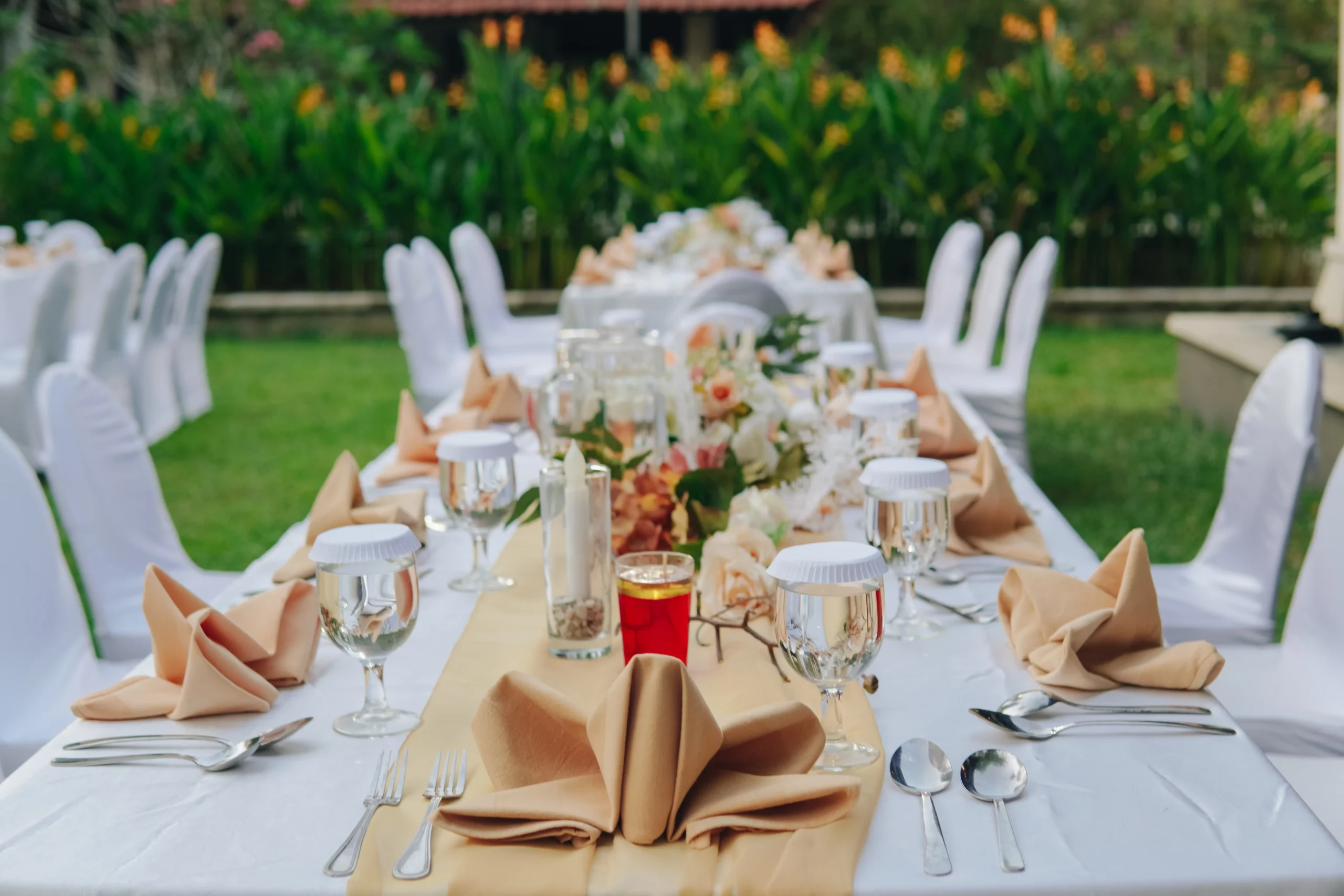 long-table-with-white-table-cloth-and-an-elegant-f-2024-12-03-23-27-33-utc