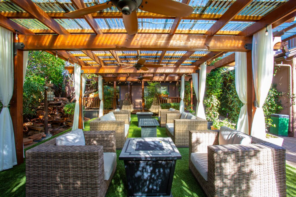 Fire pit and cozy love seats at the Lantern Light Inn and Wedding Gardens in Sedona